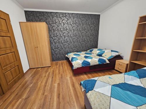 Postel nebo postele na pokoji v ubytování Mantra Wellness Apartments