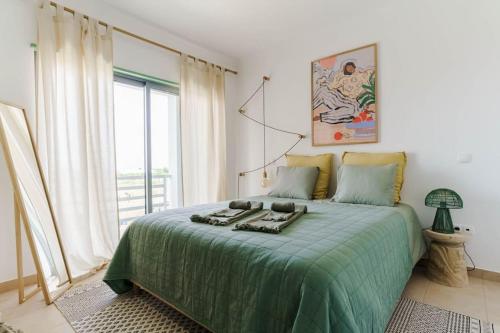 Postel nebo postele na pokoji v ubytování Green Breeze Escape