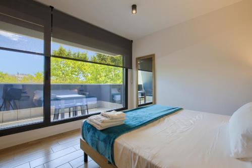 Una cama o camas en una habitación de Arena 20 Suites