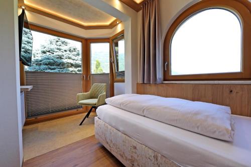Ein Bett oder Betten in einem Zimmer der Unterkunft hin&weg das Aparthotel