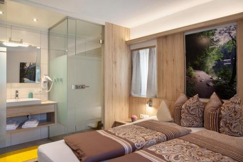 Ein Bett oder Betten in einem Zimmer der Unterkunft Ferienwohnung Piburgersee