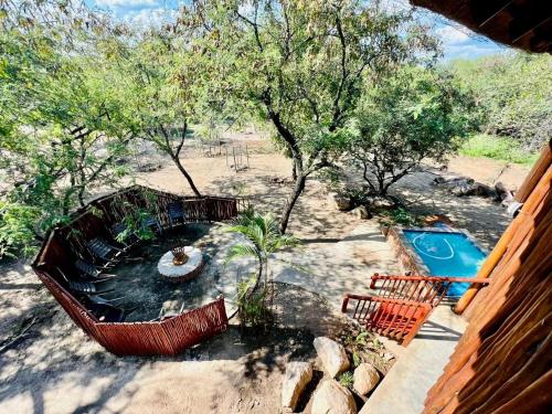 an aerial view of a backyard with a swimming pool at Zaganaga Kruger Lodge in Marloth Park