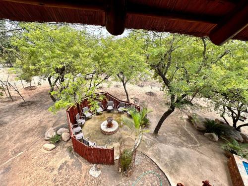 an overhead view of a garden with a table and trees at Zaganaga Kruger Lodge in Marloth Park