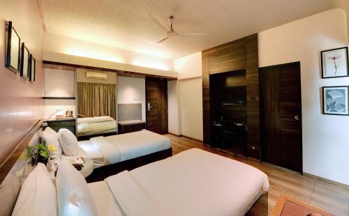 Cama o camas de una habitación en Hotel Sankam Residency