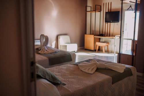Katil atau katil-katil dalam bilik di Hotel Maggio