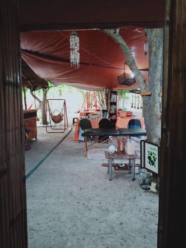a room with a tent with a table in it at JUNGLE GYM LA UNION Prana fan kubo 2 pax in Rimus