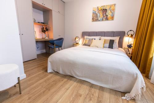 Ένα ή περισσότερα κρεβάτια σε δωμάτιο στο Navigare Apartments