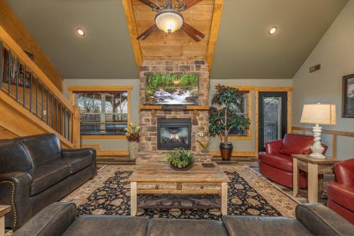 a living room with a couch and a fireplace at Beautiful Vista by Eden Crest in Pigeon Forge