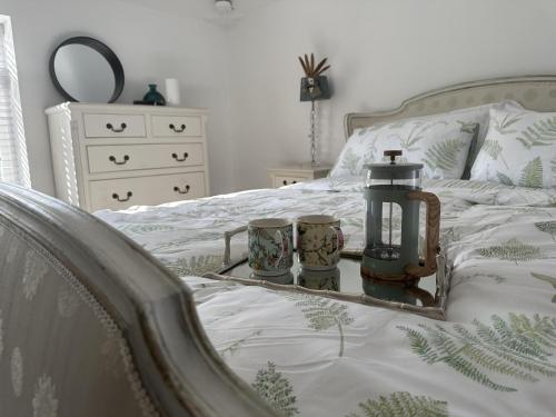 a bedroom with a bed with two candles on it at Studio - Sleeps 2 - Pets - Parking - Wifi in York
