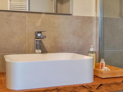a bathroom sink with a faucet on a counter at La Fonte Delle Faranghe by Host Hero in Esanatoglia