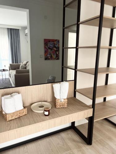 a room with a mirror and a table with baskets at Apartments Mrdak in Bar