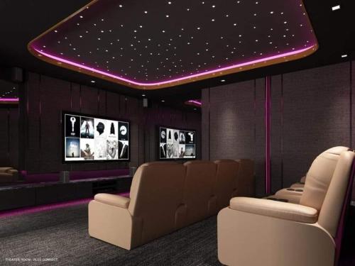 a movie room with a bunch of chairs and televisions at DiamondHouse in Hat Yai