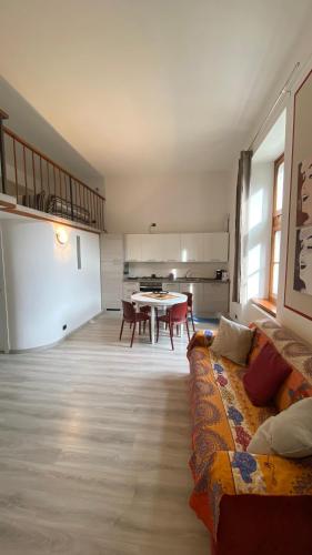 a living room with a couch and a table at Mantellini 2A in Domodossola