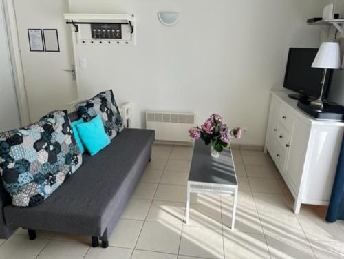 Χώρος καθιστικού στο Chalet dans résidence de vacances, 3 chambres, piscines, jacuzzi, au bord du lac