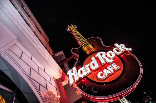 a sign for a hotel cafe with a guitar on it at Sheraton Fallsview Hotel in Niagara Falls