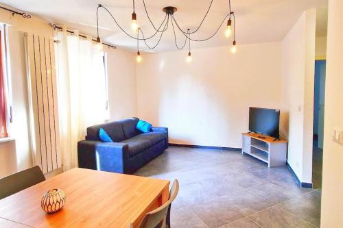 a living room with a couch and a table at Sweet Home in Serravalle Sesia