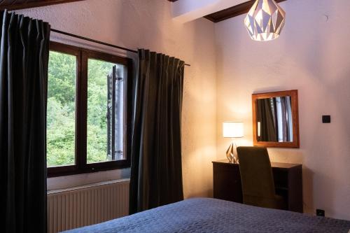 a bedroom with a bed and a window at Villa Concordia in Budva