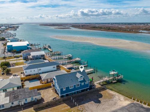 an aerial view of a house and the water at Sea Chase in Topsail Beach