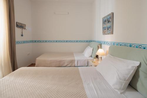 9 Muses Naxos Beach hotelにあるベッド
