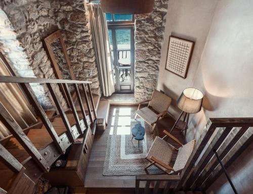 an overhead view of a staircase with chairs and a lamp at KaSeas Boutique Hotel in Gerolimenas
