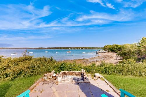 a view of a beach with boats in the water at Clark Cove in Harpswell Center