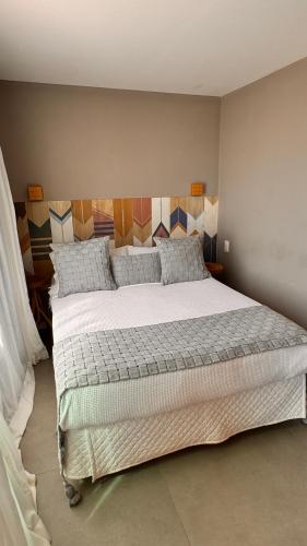 a bedroom with a large bed in a room at Pousada Alto Mar in Fernando de Noronha