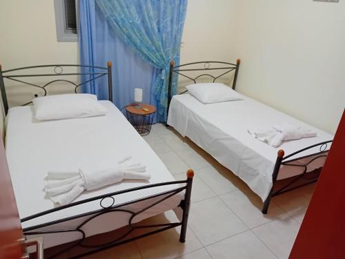 A bed or beds in a room at Bellavista House in Monolithos Rhodes
