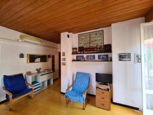 A television and/or entertainment centre at Verde Mare Aptm - Rooftop Terrace - near sea- A.C.