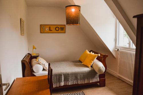 a living room with a chair and a couch at -LES LUTINS- Charmante maison les pieds dans l eau in Concarneau