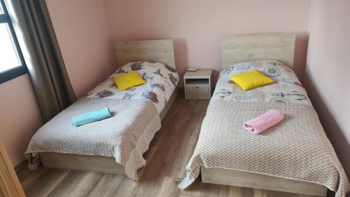 two beds sitting next to each other in a room at Nice Flat in Caesar in Iskele