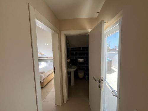 a bathroom with a sink and a toilet in a room at Belek Golf Village - Villa with private pool in Belek