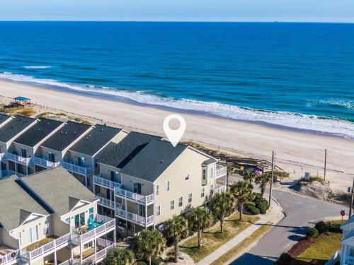 an aerial view of a building and the beach at SEArenity in Surf City