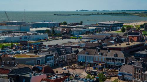 an aerial view of a city with a river and buildings at Hotel Lemmer in Lemmer
