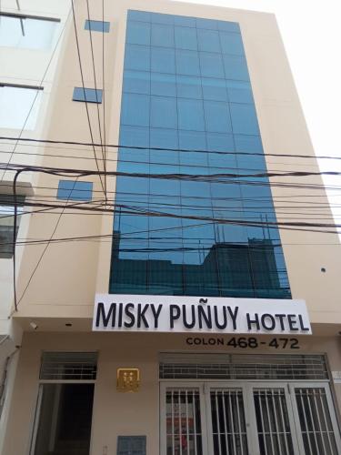 a building with a sign for a musicpunk hotel at Misky Puñuy in Chiclayo