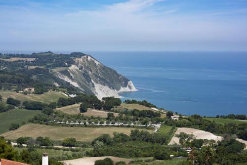 an aerial view of a mountain and the ocean at Le Relais du Lierre in Poggio