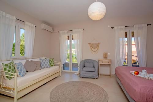A bed or beds in a room at Cosmos Villas Spyridoula