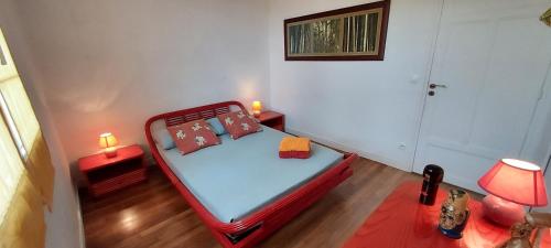 Ένα ή περισσότερα κρεβάτια σε δωμάτιο στο Chambre 1 Chambre Bambou
