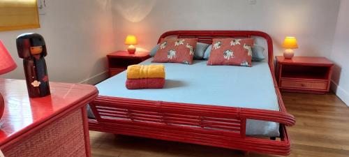 Ένα ή περισσότερα κρεβάτια σε δωμάτιο στο Chambre 1 Chambre Bambou