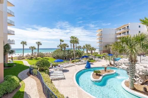 an image of a resort with a swimming pool and the ocean at Waterscape in Fort Walton Beach