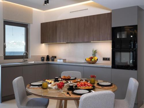 a kitchen with a table with fruit on it at Terra Della Salvia in Crete in Gournes