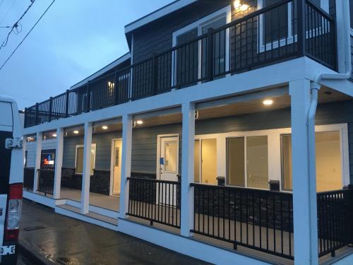 a building with balconies on the side of it at Dock Street Inn in Westport