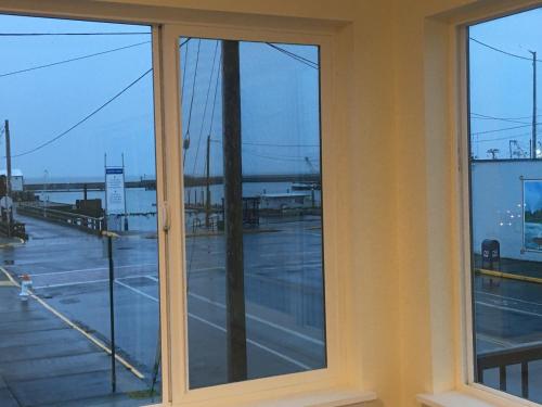 a window in a building with a view of a parking lot at Dock Street Inn in Westport