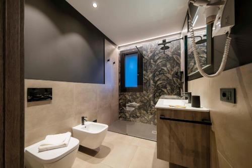 Bagno di ApartmentsGarda - Residenza Garda Deluxe