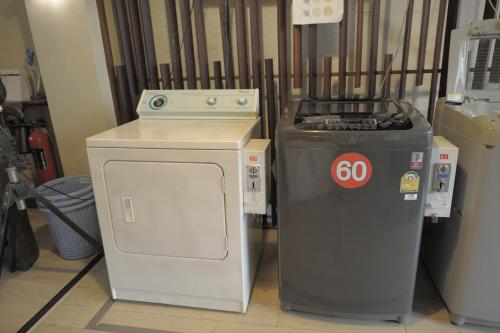 a stove and a trash can sitting next to each other at KENCOZY accommodation in Bangkok
