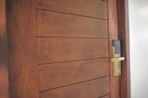 a close up of a wooden door at KENCOZY accommodation in Bangkok