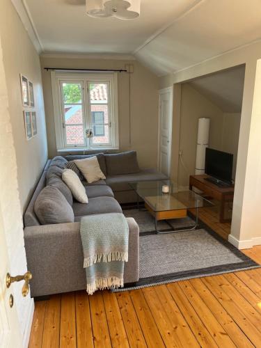 a living room with a couch and a table at Gamla Stan in Falkenberg