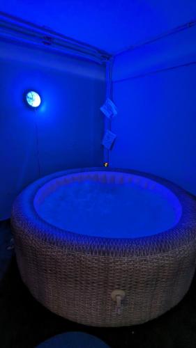 a blue room with a large tub in a room at Villa della Tartaruga in Casal Palocco