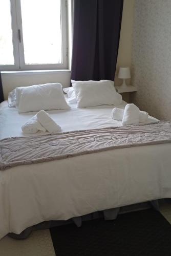 Ένα ή περισσότερα κρεβάτια σε δωμάτιο στο Liber Guest House