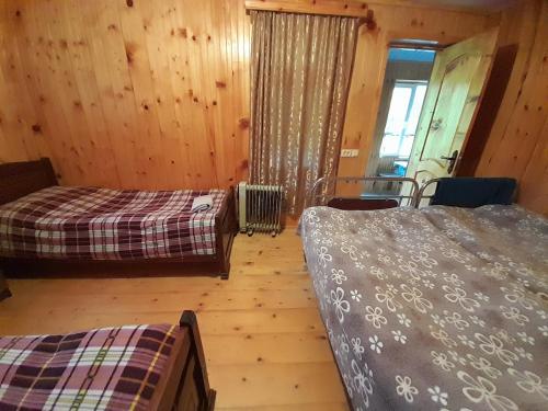 Postel nebo postele na pokoji v ubytování Guest House Zhora Kaldani