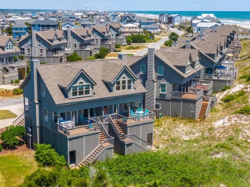 an aerial view of a row of houses at Slow Motion #8A in Topsail Beach